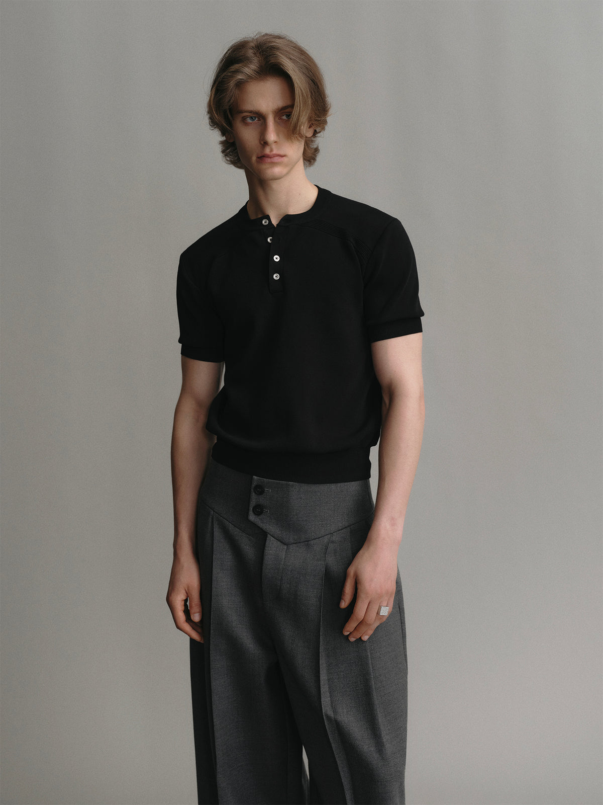 Black crew neck pullover short sleeve knit sweater with metal buckle design