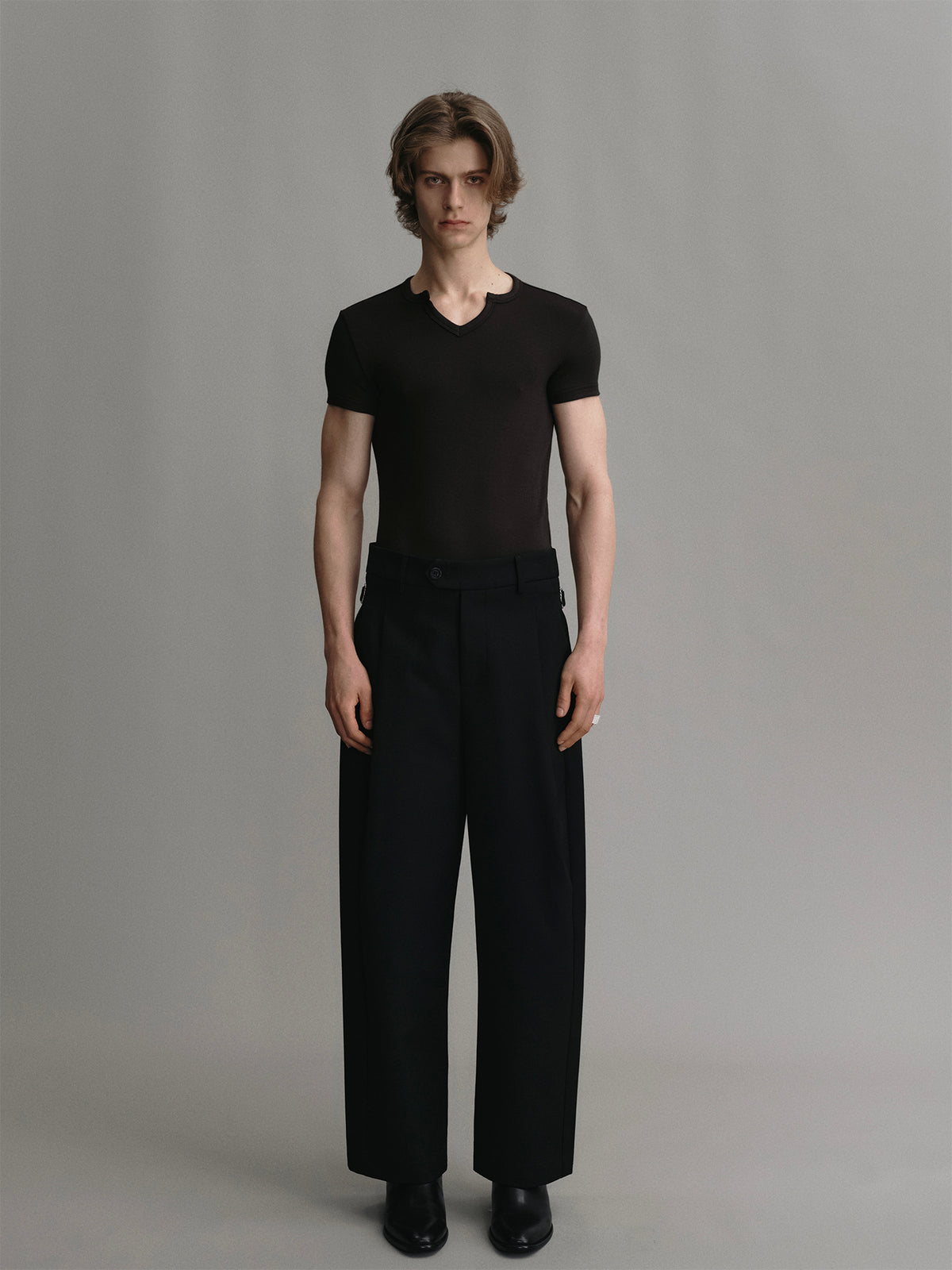 Black wool curved cropped trousers