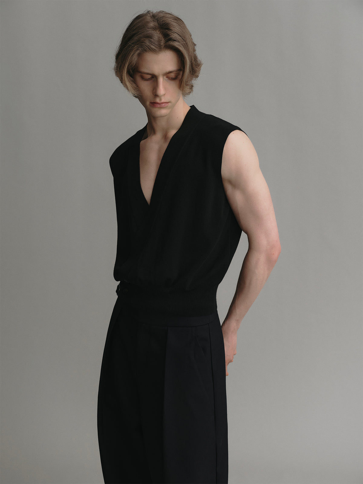 Black knitted vest with cross v neck and two button made of acetate wool